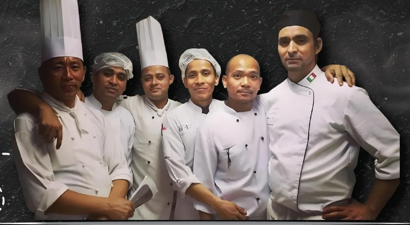 Le chef et cinq cuisiniers de Beirut Dishes en tenue blanche, côte à côte